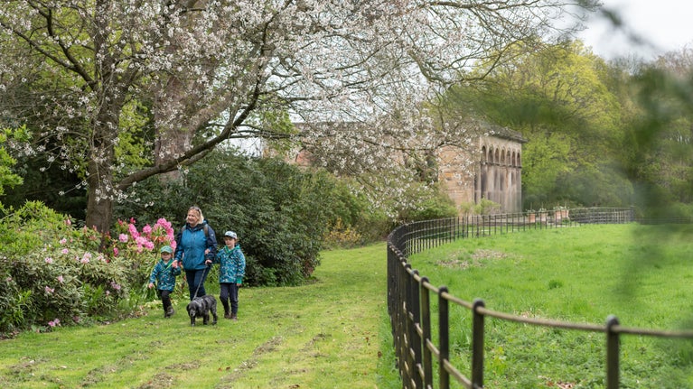 A family walking near the Orangery at Gibside